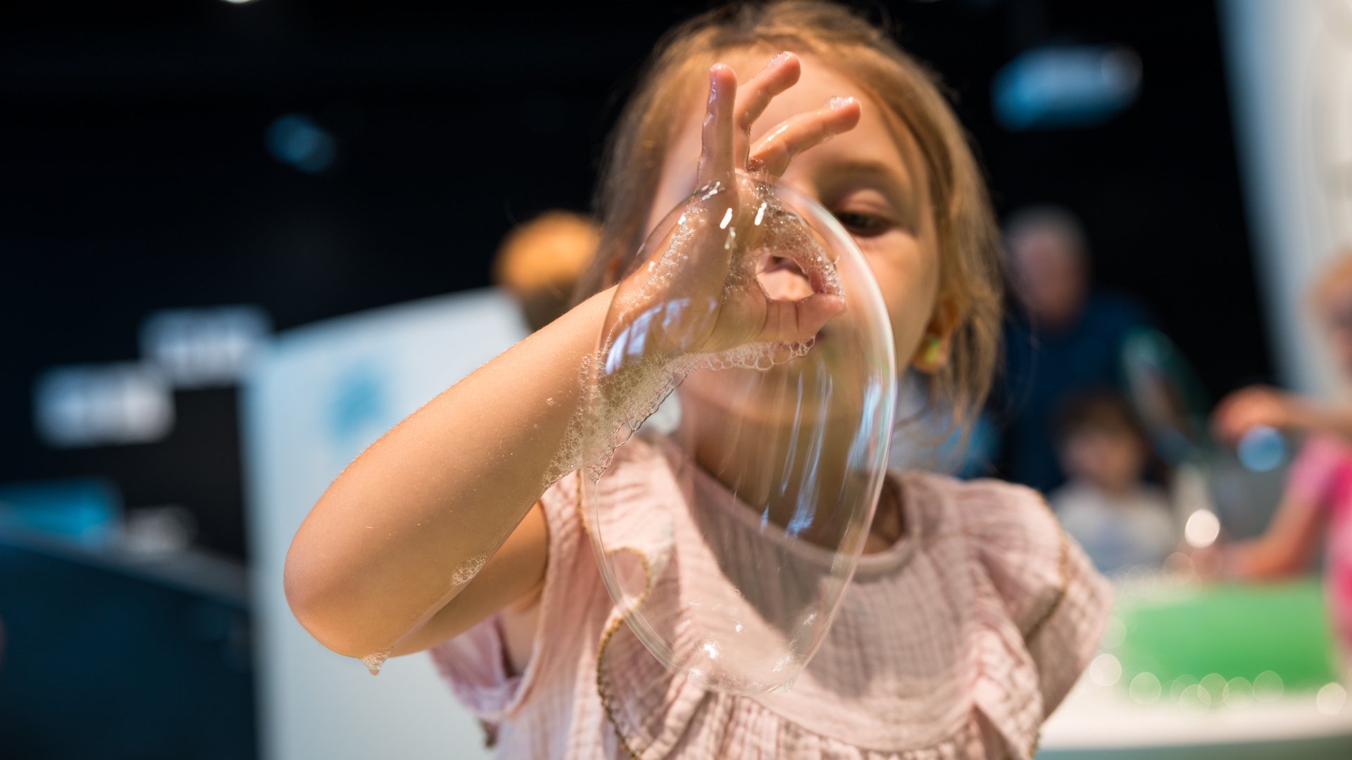 Kid blowing soap bubbles at Experimentarium Kid blowing soap bubbles at Experimentarium